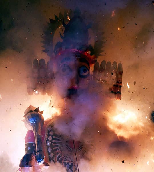 An effigy of demon king Ravana being set on fire during the Dusshera celebrations of Shri Dharmic Leela Committee at Red Fort ground