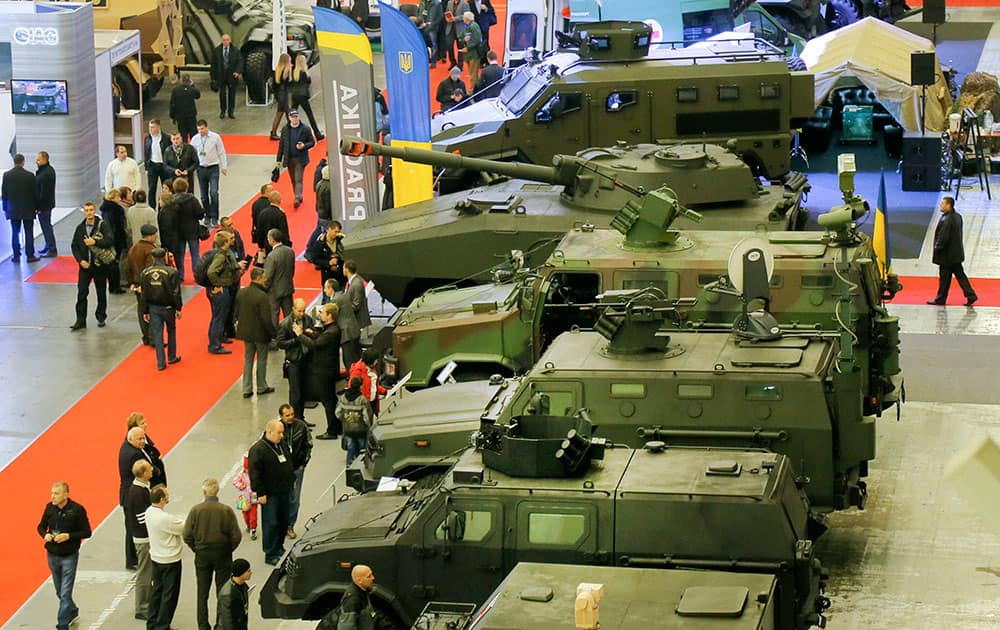 People attend an armament exhibition of Ukrainian made weapons in Kiev