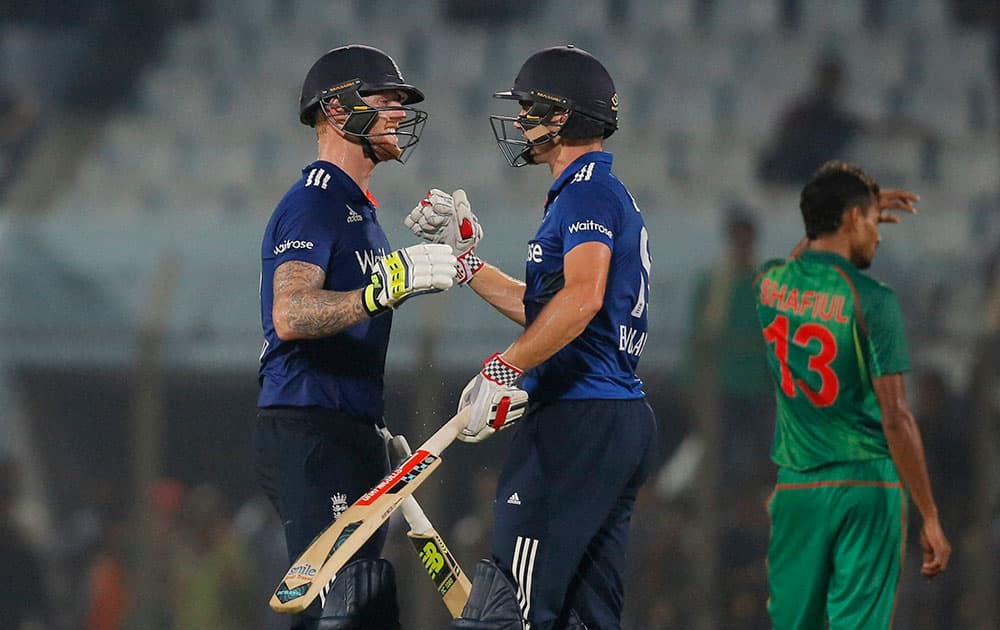 Ben Stokes and Chris Woakes celebrate their victory over Bangladesh in the third one-day international cricket match in Chittagong