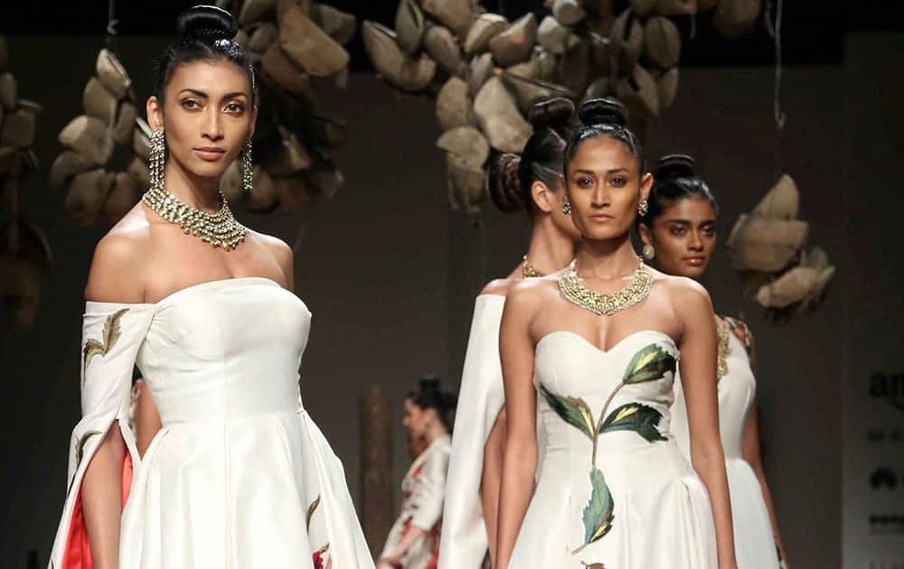 Models walk on ramp for the designer Samant Chauhan during the inaugural show of Amazon India fashion week in New Delhi