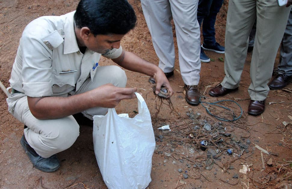 Experts from bomb disposal squad defuse a handmade bomb