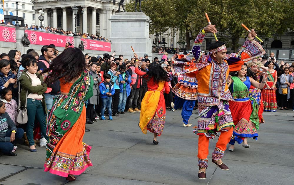 People gather to watch the London Diwali Festival celebrations for Hindus, Sikhs, and Jains, in Trafalgar Square