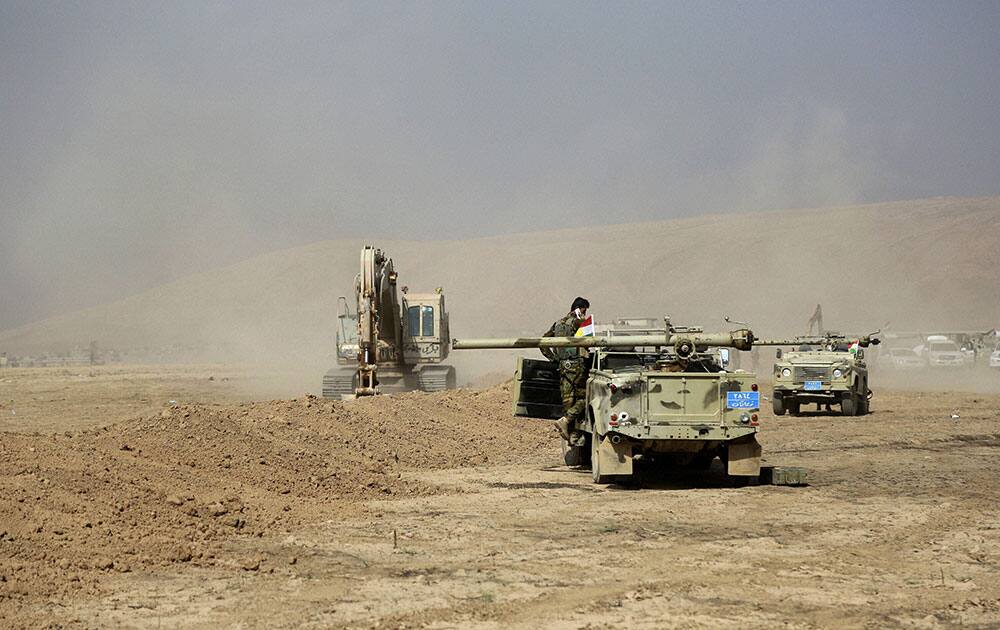 A peshmerga convoy drives towards a frontline in Khazer