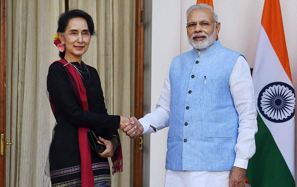 PM Narendra Modi shakes hands with Myanmar State Counsellor and Foreign Minister Aung San Suu Kyi