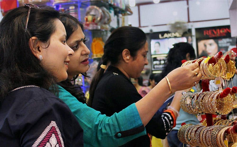 Women shop for bangles ahead of the Hindu festival of 'Karva Chauth'