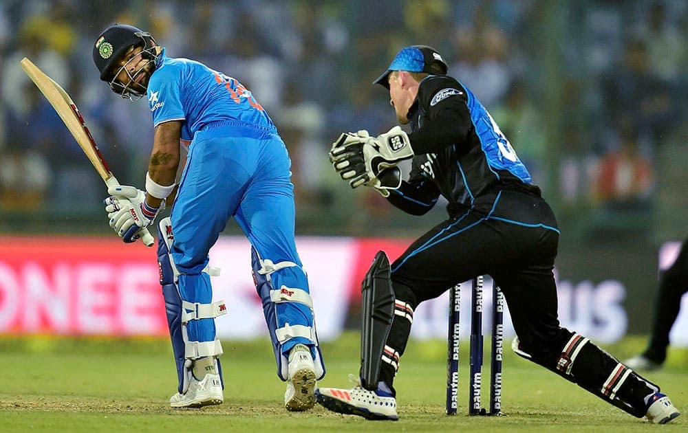 Virat Kohli and New Zealand wicket keeper L Ronchi