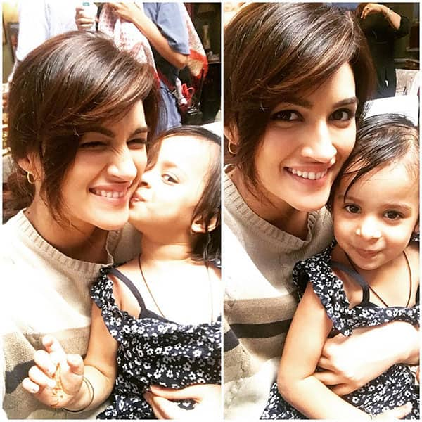 kriti sanon :- This cute lil fan has been roaming arnd the set everyday n she is adorable!!