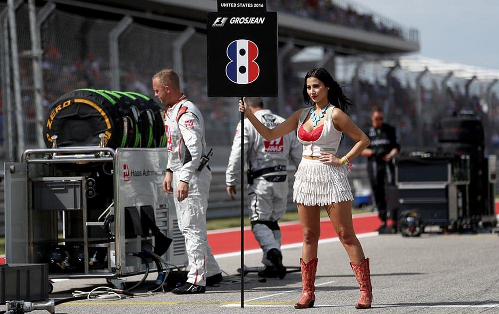 The grid girl for Romain Grosjean of France and Haas F1