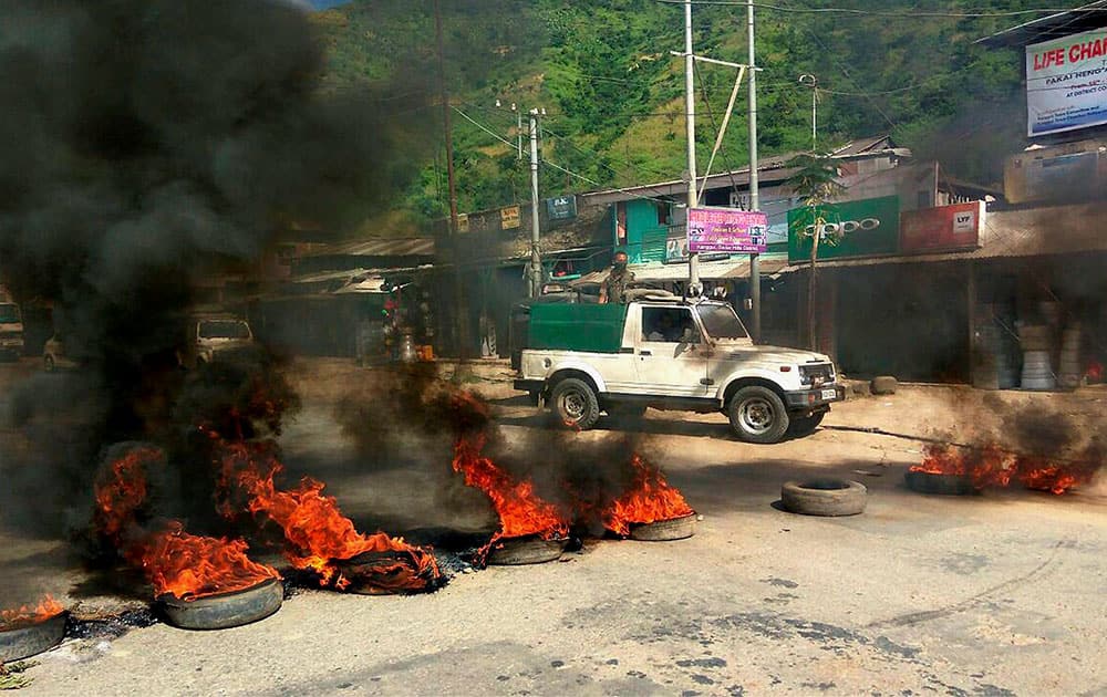 Protesters burn tyres in protest against Manipur Chief Minister Okram Ibobi Singh