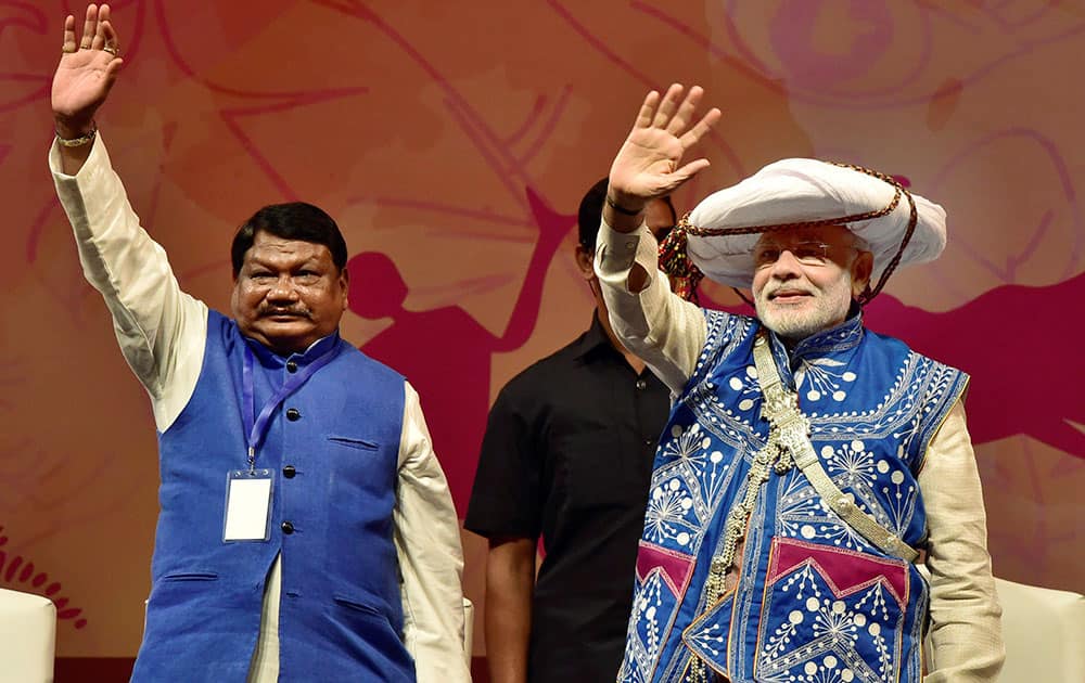 Prime Minister Narendra Modi waves at gathering at the inauguration of the National Tribal Carnival-2016 in New Delhi