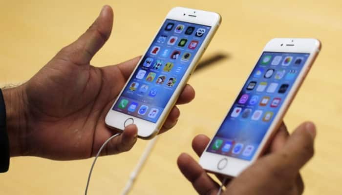 Apple iPhone sales fall but beat estimates; shares slip