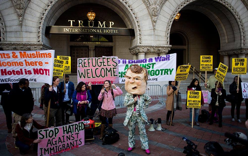 Protestors demonstrate outside the new Trump International Hotel