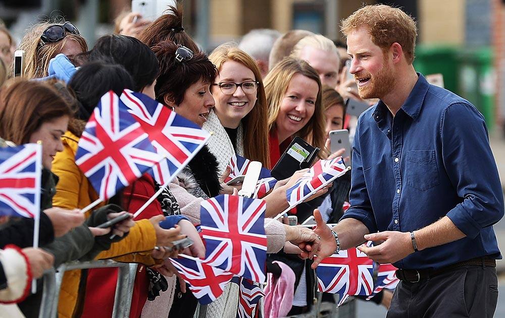 Prince Harry meets the crowd ahead of a visit to Coach Core at The National Ice Centre