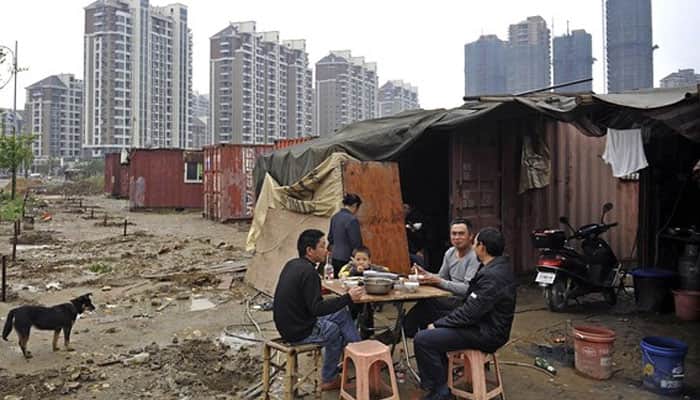 China to invest $140 billion to relocate poor citizens to more developed areas