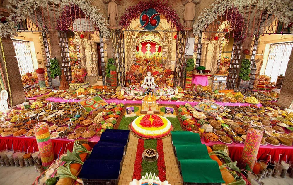 Temple decorated with various delicacies and flowers as an offering to Lord Swaminarayan on the occasion of Annakoot Darshan in Surat