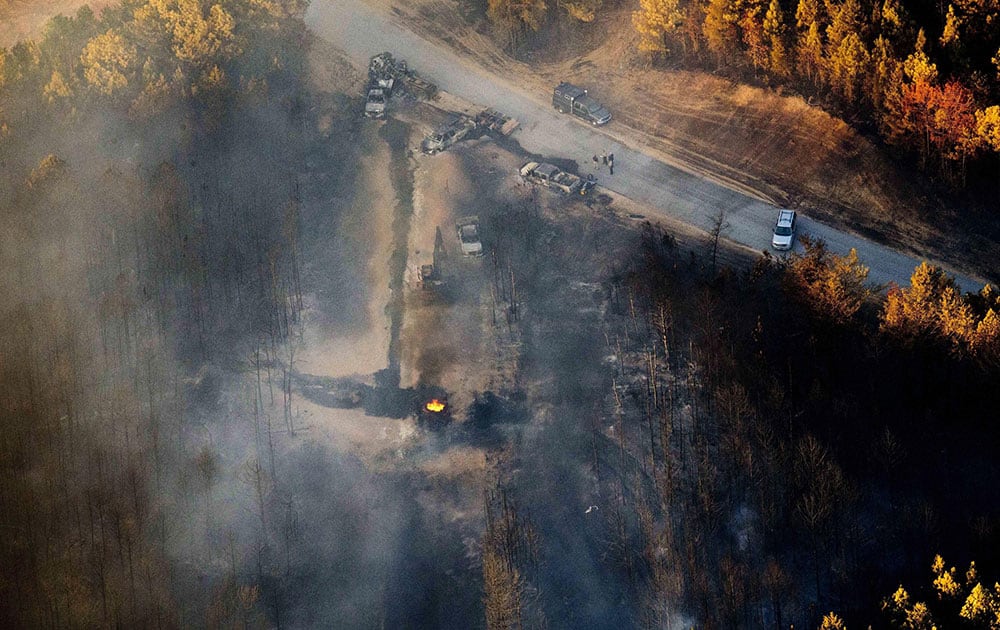 A flame continues to burn after a Monday explosion of a Colonial Pipeline