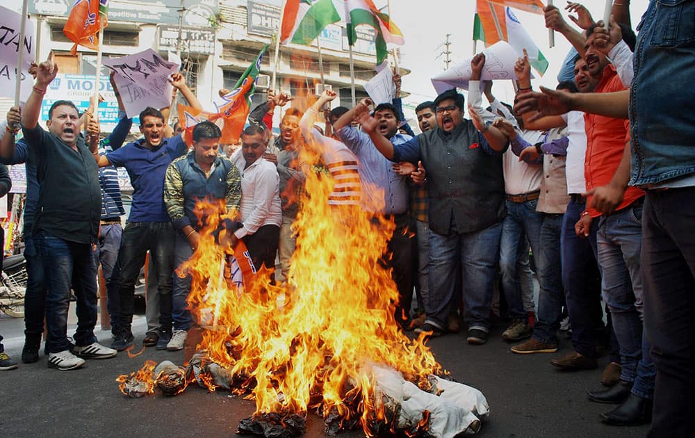 Activists of Bharatiya Janata Yuva Morcha (BJYM) burn an effigy representing Pakistan