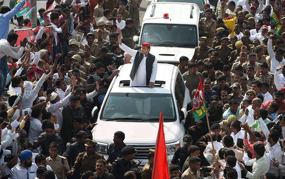 Uttar Pradesh Chief minister Akhilesh Yadav waving at people during his Rath Yatra in Lucknow