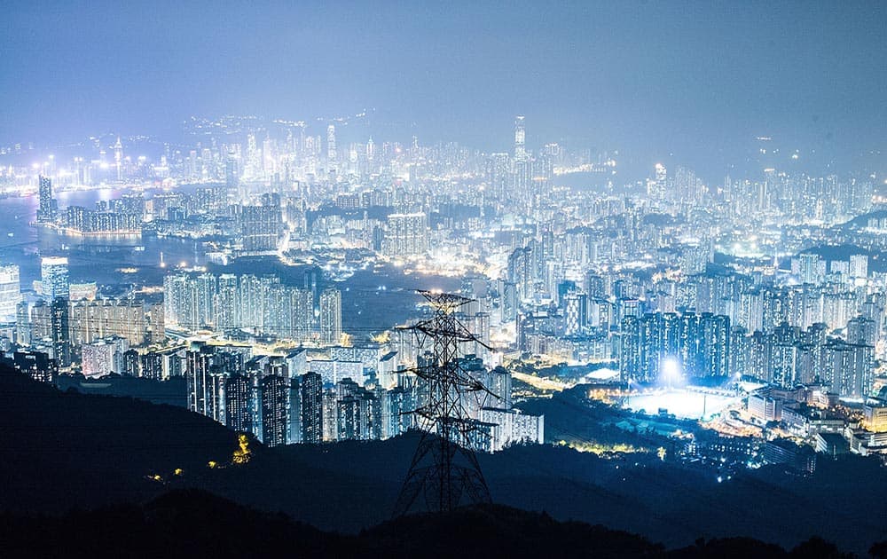 The view from Kowloon Peak shown apartment buildings and office blocks lights at night