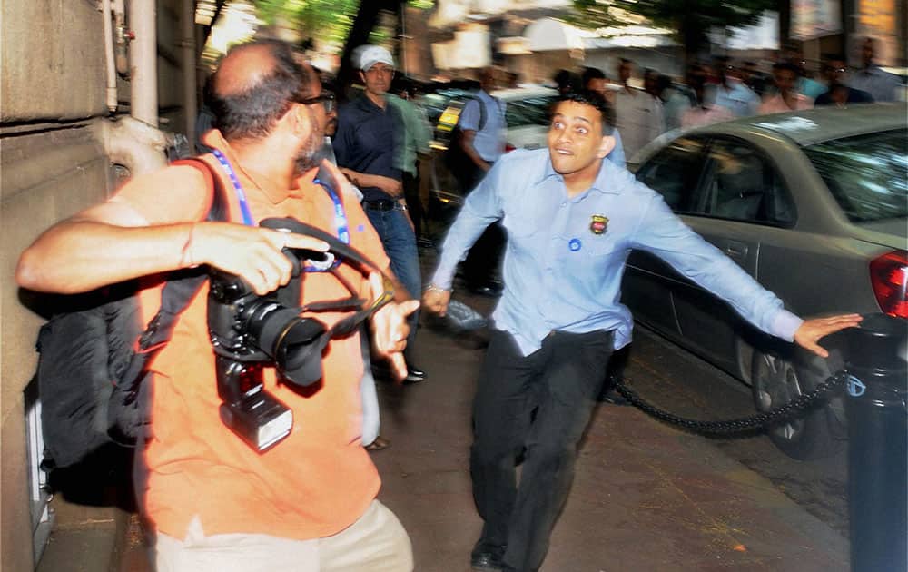 Private security personnel of Tata Group assault photojournalists who had assembled ahead at Bombay House for the Indian Hotels board meeting in Mumbai