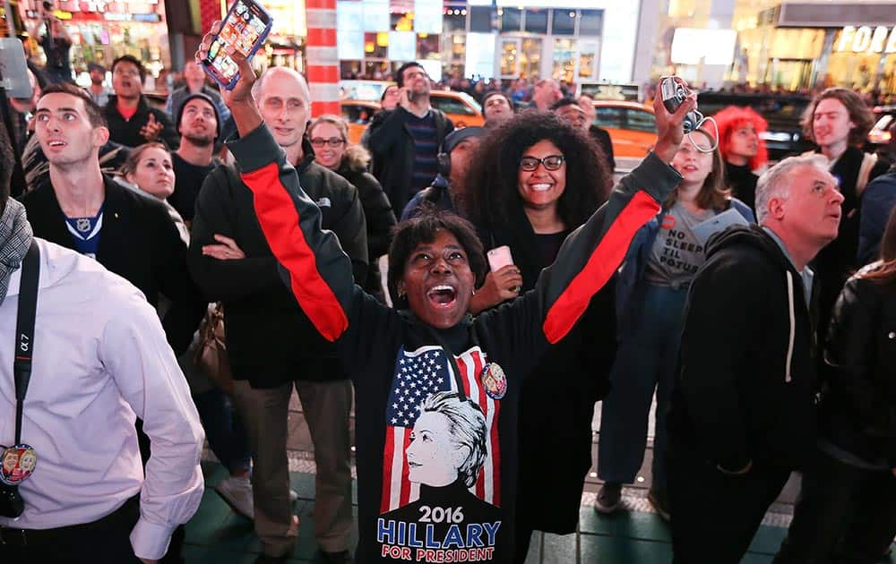 A Hillary Clinton supporter reacts after she was projected to win the state of California