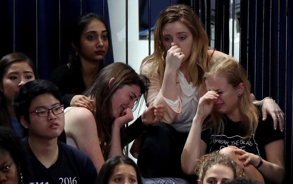 A group of women react as voting results come in at Democratic presidential nominee former Secretary of State Hillary Clinton