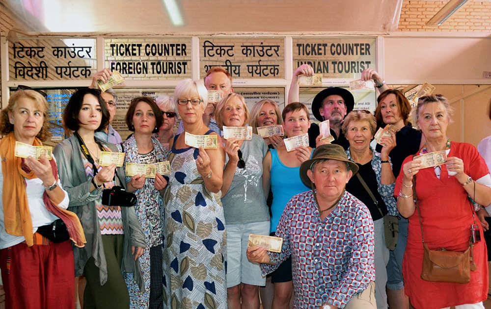 A group of foreign tourists upset over the refusal of Rs 500 and Rs 1000 notes at the ticket window of Taj Mahal in Agra