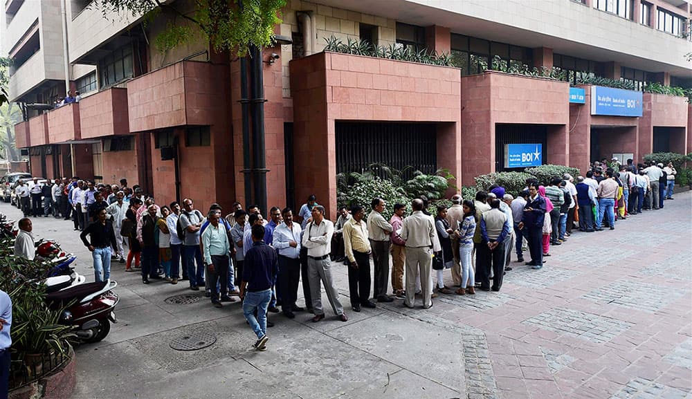 People queue outside Bank of India to exchange their old Rs 500 and 1000 notes in New Delhi People queue outside Bank of India to exchange their old Rs 500 and 1000 notes in New Delhi
