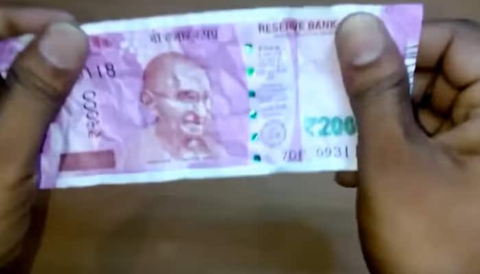 Dip your new Rs 2,000 note in water for 30 minutes and see the result - Amazing video