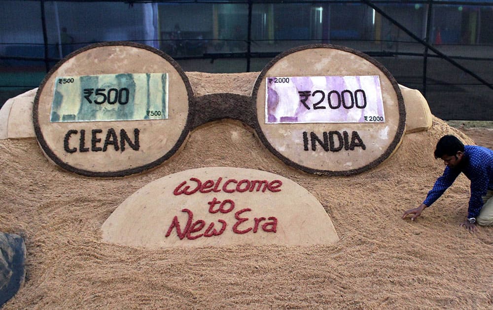 Sand art on new currency notes