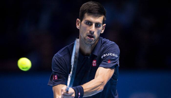 Novak Djokovic battles past Milos Raonic&#039;s challenge to book last four spot at ATP Tour Finals