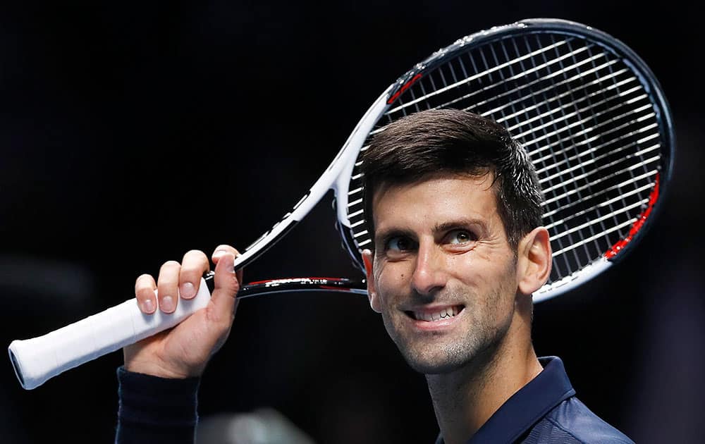 Novak Djokovic celebrates winning match point during  ATP World Tour Finals 