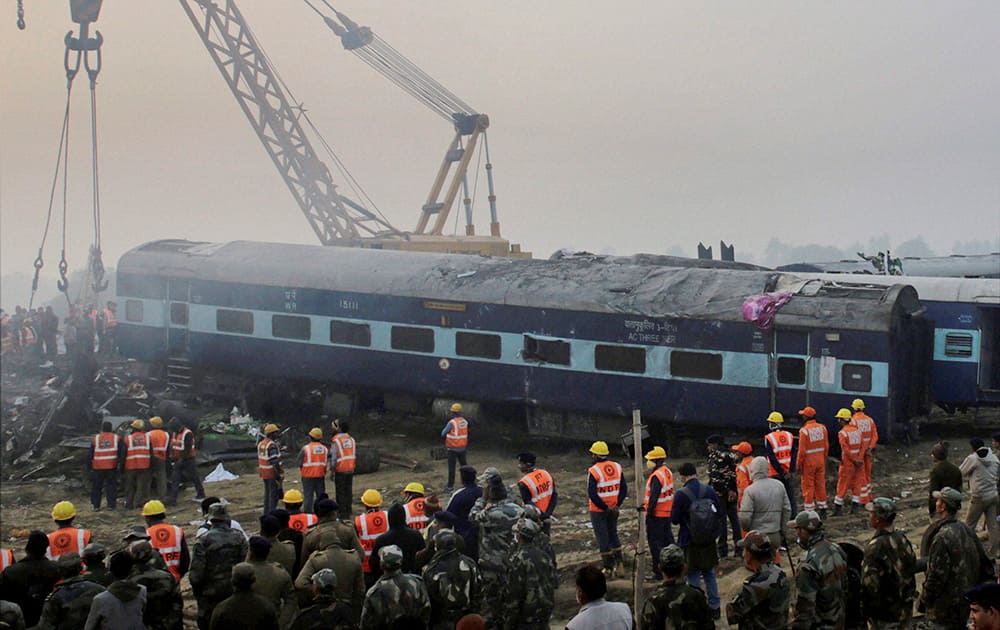 Rescuers work in progress at the site of accident where Patna-Indore Express train derailed