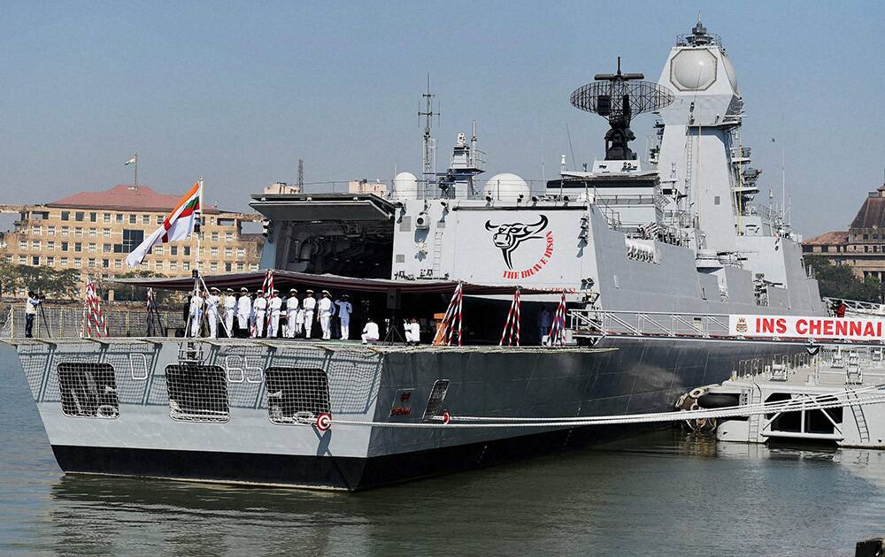 Naval officers hoisting their flag during the commissioning ceremony of naval warship INS Chennai in Mumbai