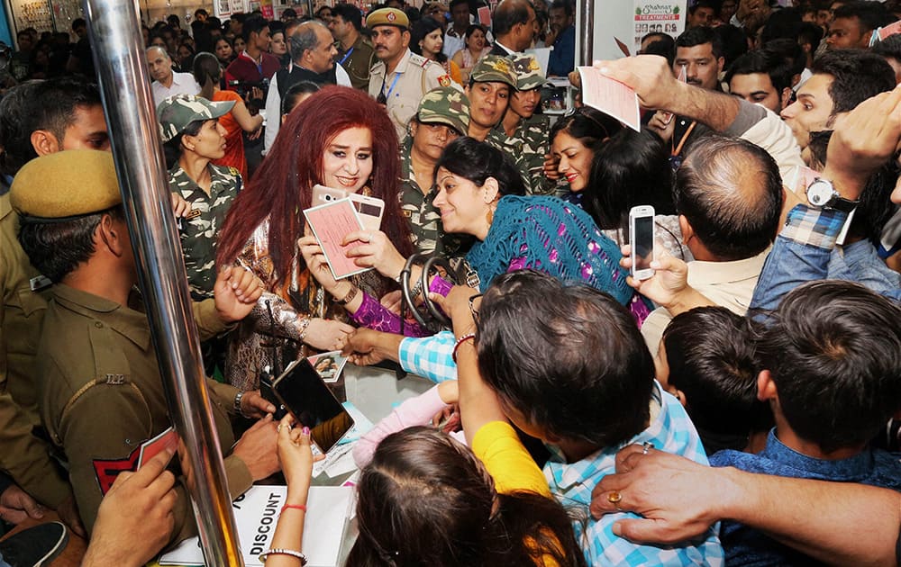 A woman clicks selfies with Shahnaz Husain during the India International Trade Fair, 2016, in New Delhi