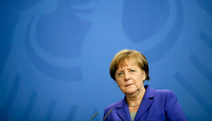 Relief but muted enthusiasm as Merkel vows to run again