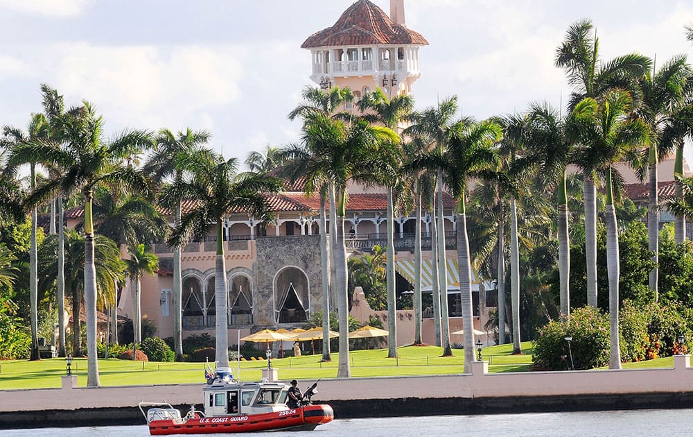 A US Coast Guard boat passes through the Mar-a-Lago Resort where President-elect Donald Trump will be spending Thanksgiving