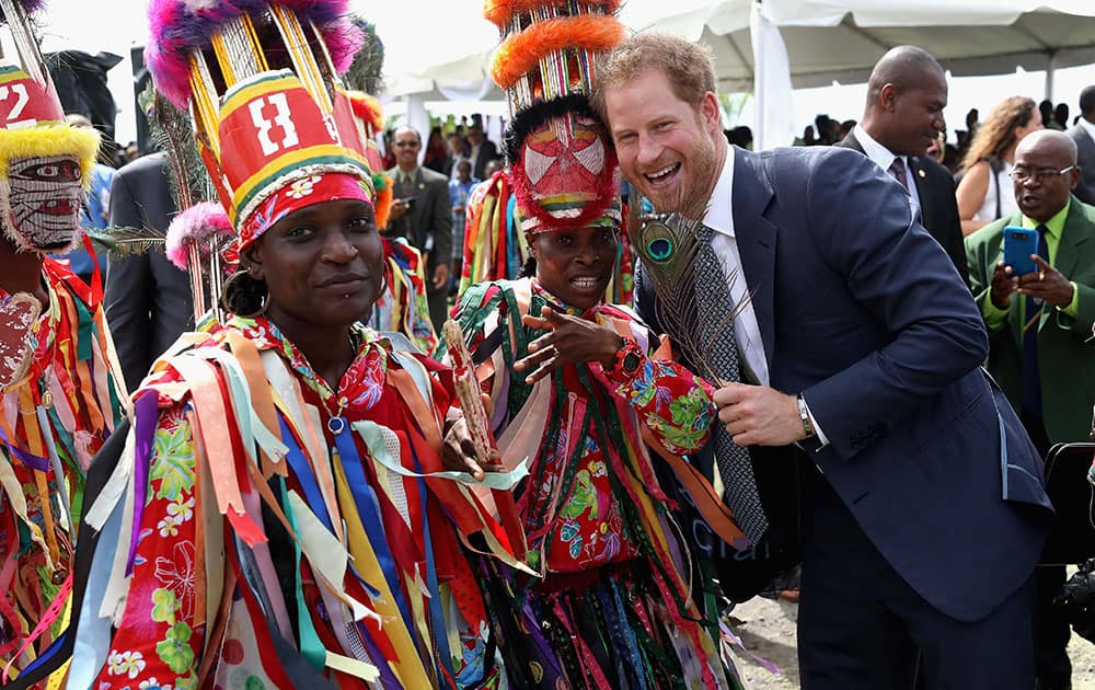 Prince Harry is greeted by cultural dancers at Brimstone Fortress