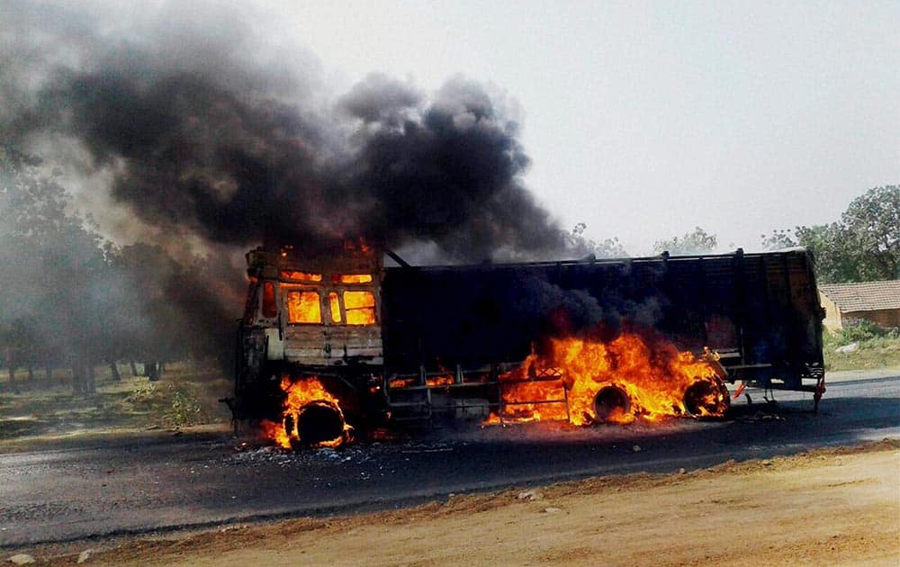 Protesters set a truck ablaze during the Jharkhand Bandh called by Opposition parties