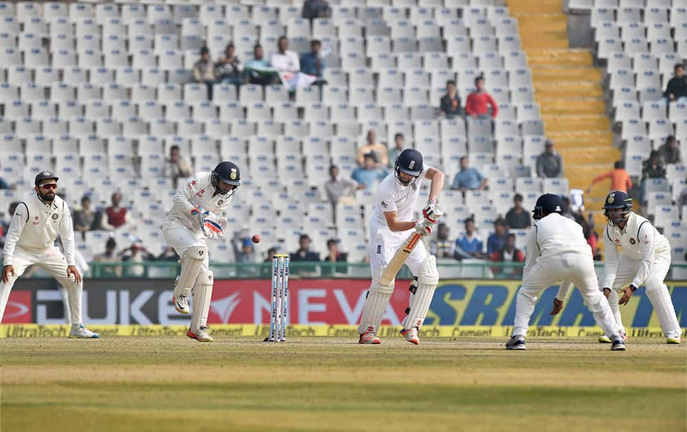 England batsman Chris Woakes plays a shot on the fourth day of the third Test match between India and England in Mohali