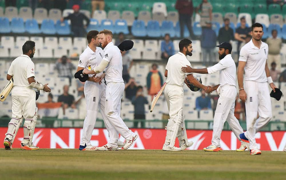 Players of India and England greet each other after India won the third Test match between India and England in Mohali