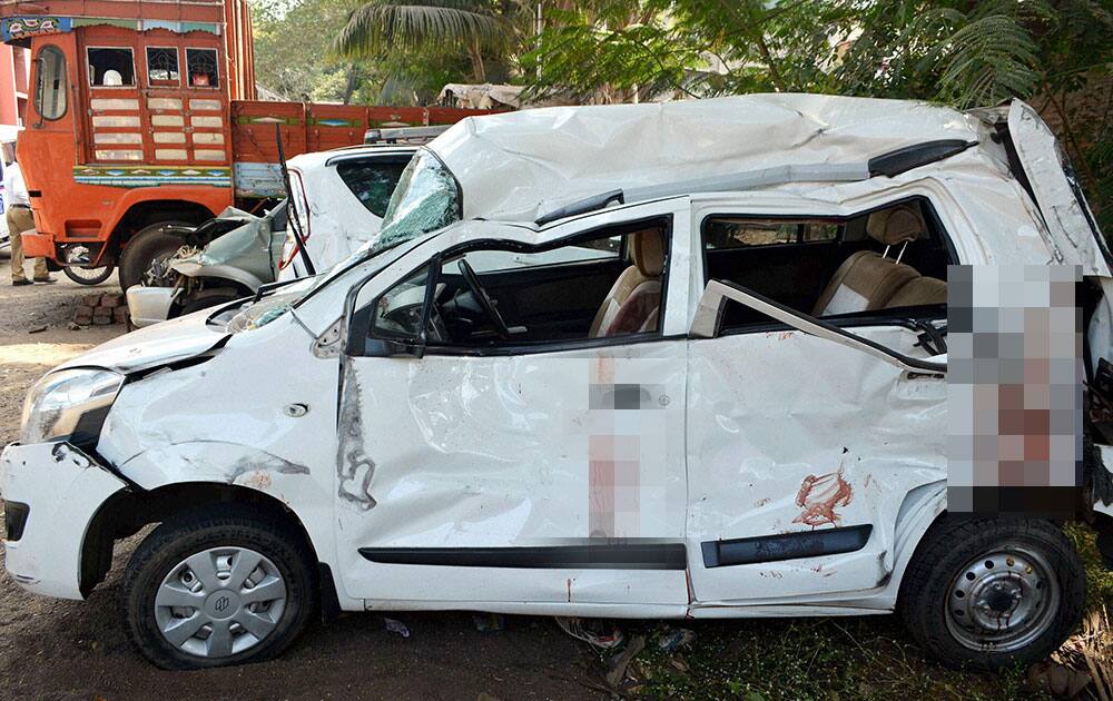 A heavily damaged car after it was involved in an accident killing a woman on the Pune-Bengalore highway in Karad