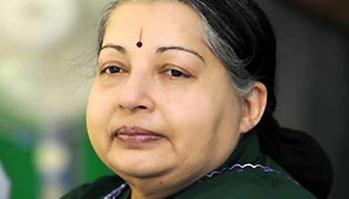 Jayalalithaa laid to rest near MGR Memorial in Chennai clad in her favourite green saree!