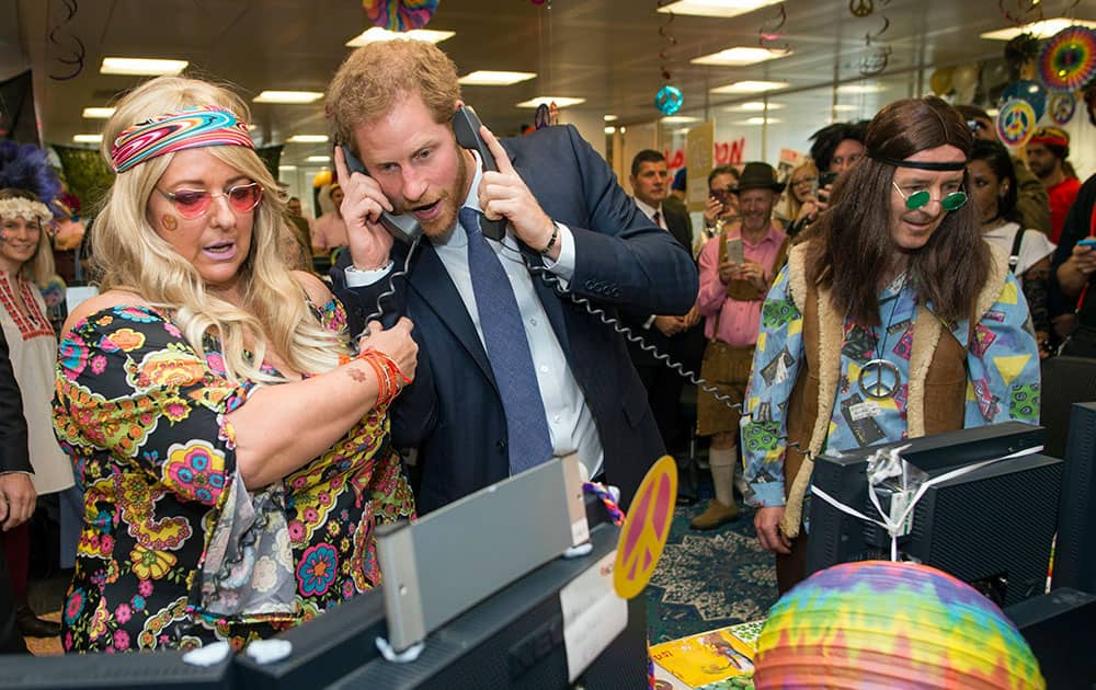 Prince Harry talks on the phone, during an ICAP Charity Trading Day