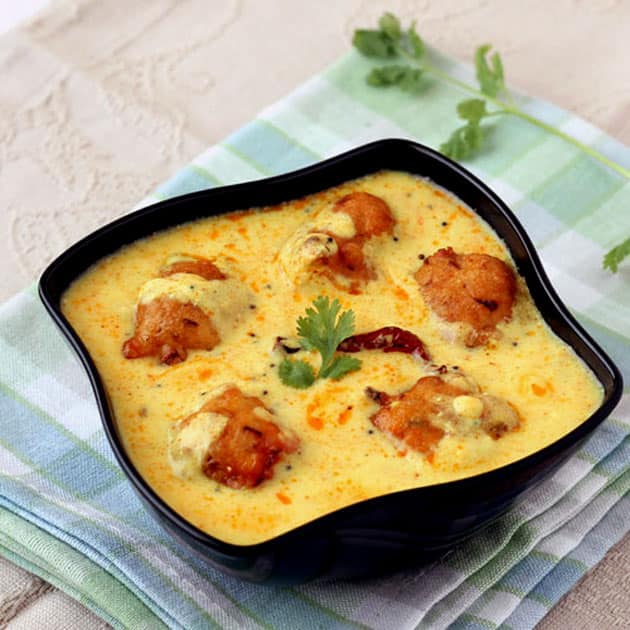 Kadhi Pakora (traditional curry with pakoras) and rice