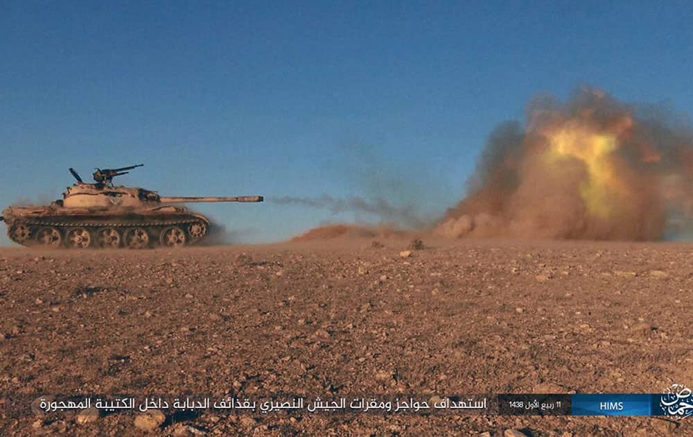 A tank operated by the group firing at Syrian troops A tank operated by the group firing at Syrian troops