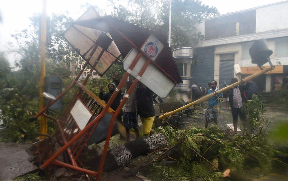 Uprooted poles and trees following a storm in Chennai