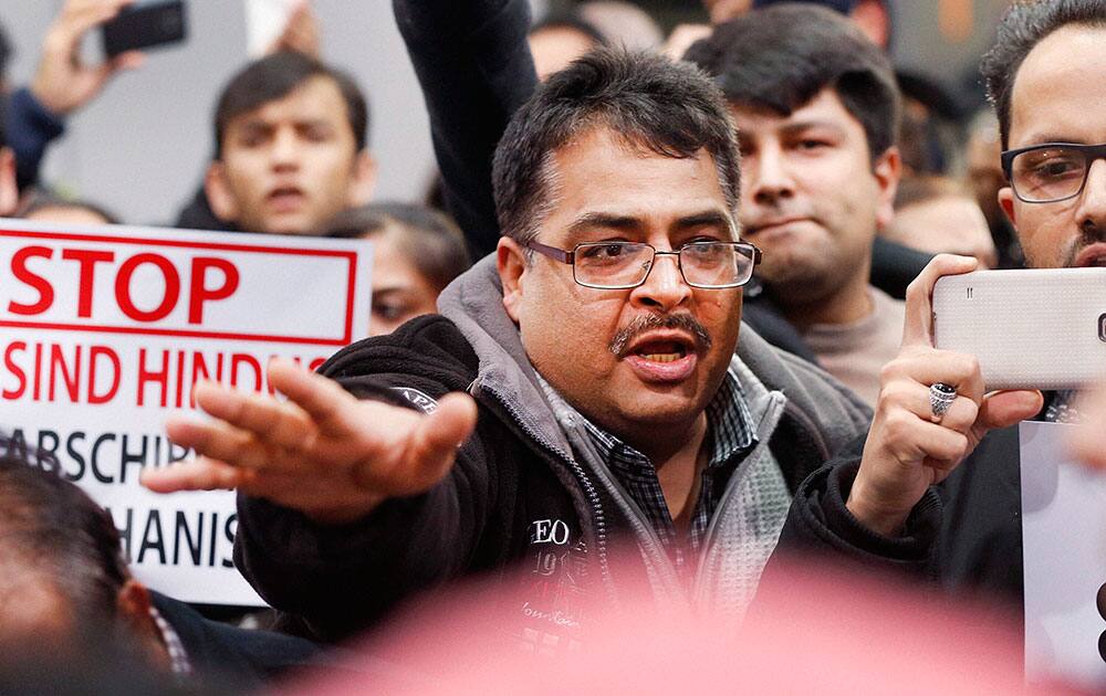 A demonstrator shouts during a protest