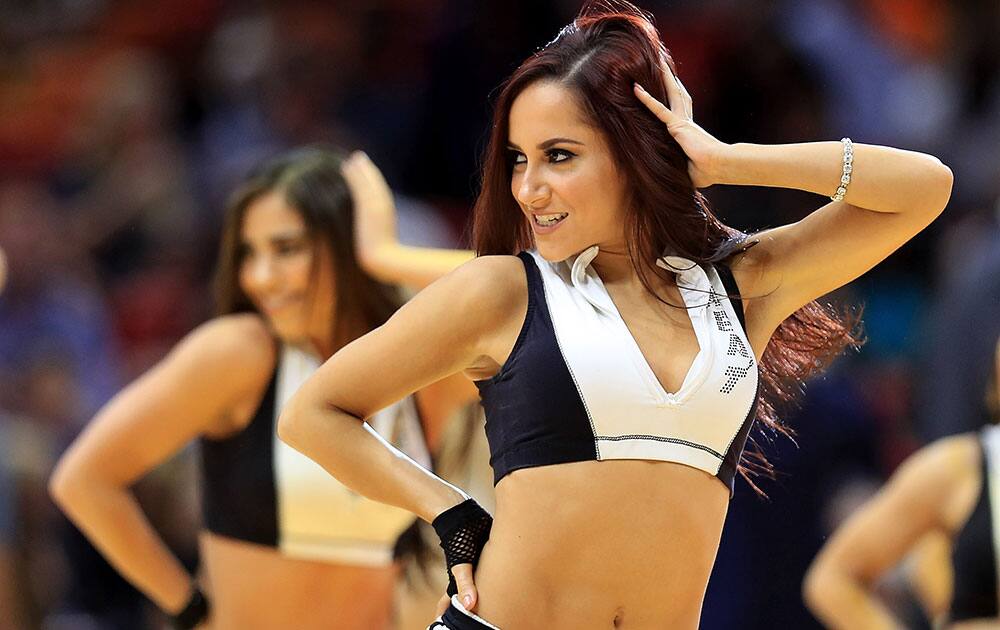 A Miami Heat dancer performs during a game