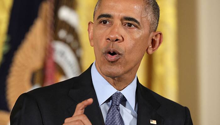 Barack Obama says US will retaliate against Russian hacking